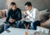 Online Brokers vs Traditional Brokers: What South African Investors Should Know Brokers discussing investment services in an office