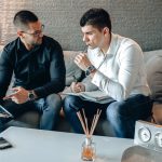 Online Brokers vs Traditional Brokers: What South African Investors Should Know Brokers discussing investment services in an office