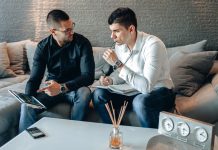 Online Brokers vs Traditional Brokers: What South African Investors Should Know Brokers discussing investment services in an office