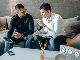 Online Brokers vs Traditional Brokers: What South African Investors Should Know Brokers discussing investment services in an office