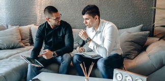 Online Brokers vs Traditional Brokers: What South African Investors Should Know Brokers discussing investment services in an office