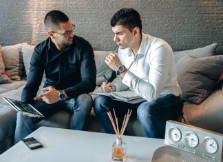 Brokers discussing investment services in an office